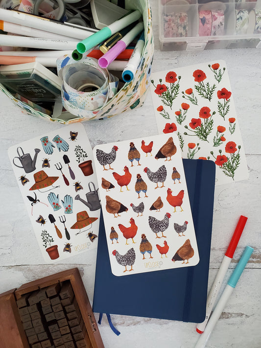 This bundle includes three sticker sheets. The first is gardening tools, bumble bees and plants. The second is a variety of chickens. The third is red poppies. 