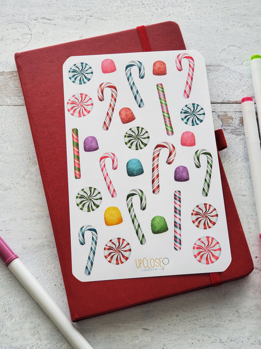 Sticker sheet featuring colorful illustrated candy canes, peppermints and gum drops.