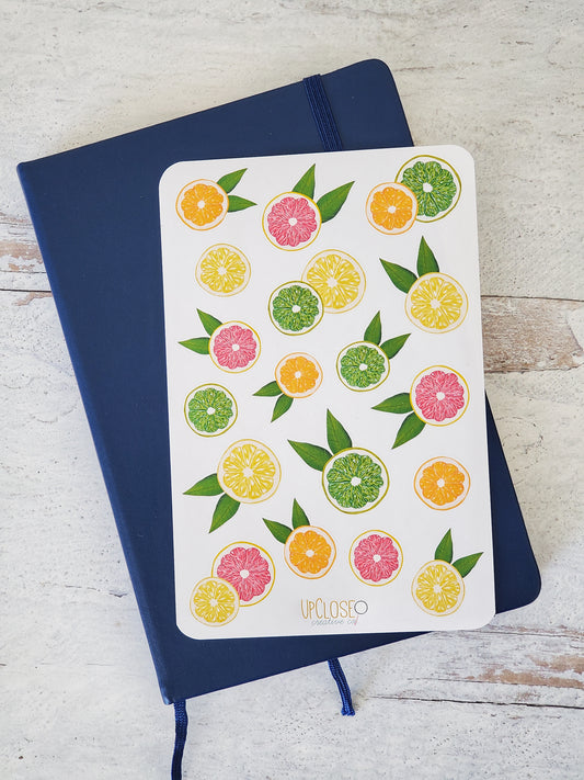 This sticker sheet features colorful illustrations of citrus fruit slices, limes, lemons, oranges and pink grapefruits